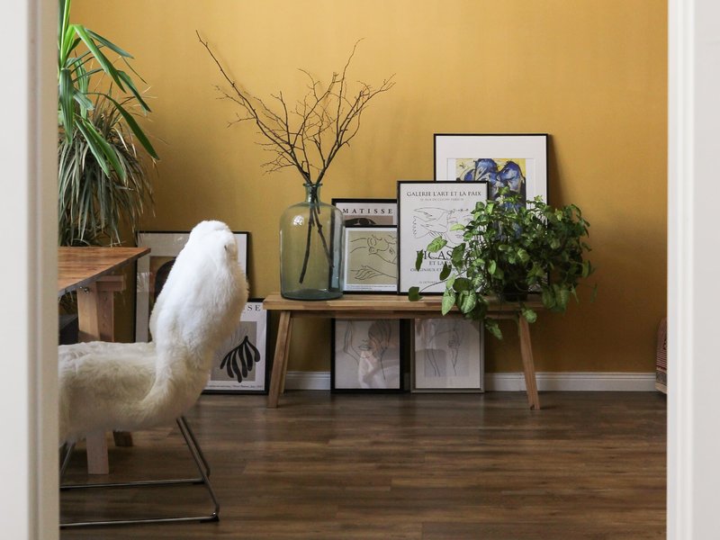 Study with hardwood floor and furry white chair